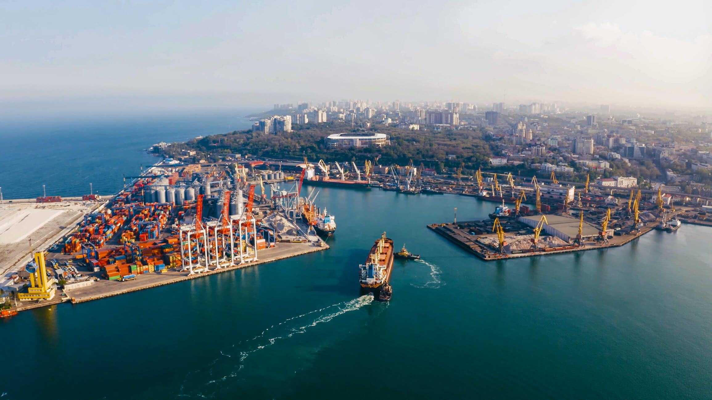 Cargo ships docked at industrial harbor